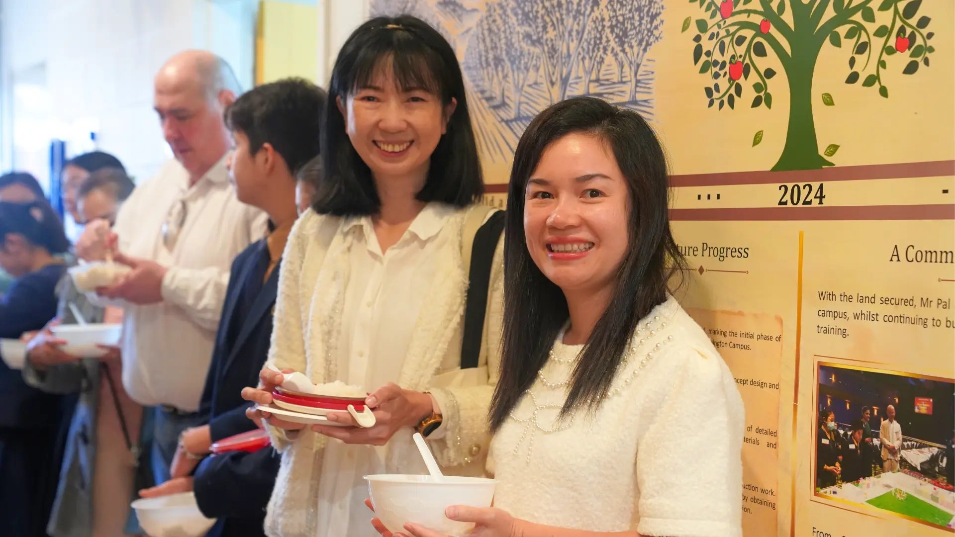 People talking over tea after a Dhamma talk